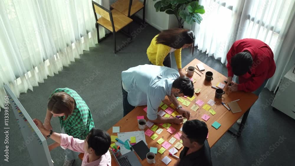 Poster top view of diverse business people writing and stick sticky notes at whiteboard. creative team work