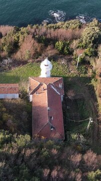 Aerial Lighthouse Across Sea