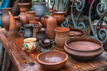 Rustic utensils on the table. Dishes made of clay. Ceramic kitchen utensils