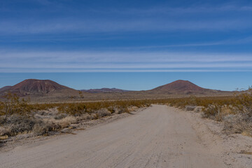 Cinder Cone / Scoria Cone with Lava Flow. Cima volcanic field. Kelbaker Road, Mojave National Preserve. San Bernardino County, California. Mojave Desert / Basin and Range Province. 