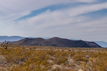 Cinder Cone / Scoria Cone with Lava Flow. Cima volcanic field. Kelbaker Road, Mojave National...