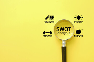 SWOT Analysis Infographic Design under magnifying glass over yellow background concept for...
