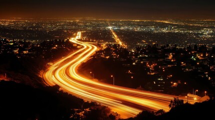 Fototapeta premium Nighttime cityscape with illuminated roads and urban lights.