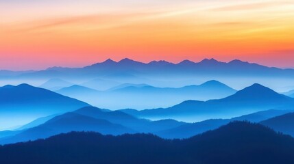 Fototapeta premium Serene mountain landscape at sunset with layers of blue and orange hues.