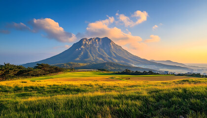 Fototapeta premium Majestic Mountain Landscape at Sunset with Golden Fields
