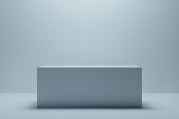 A minimalist gray rectangular pedestal against a plain backdrop, emphasizing simplicity.
