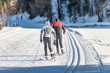 Couple man and woman cross-country skiers