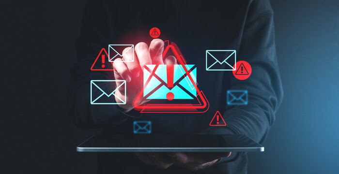 Digital spam warnings over tablet screen in dark background.