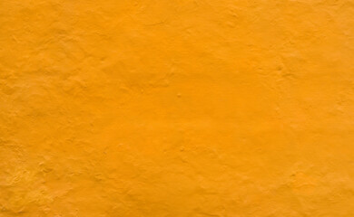 Yellow stucco wall background texture
