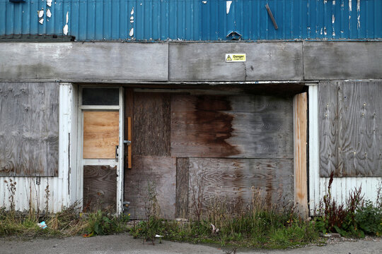 Disused warehouse with broken windows and boarded door - Powis terrace - Aberdeen city - Scotland - UK