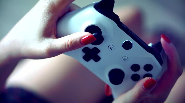 Hands holding gaming controller in action