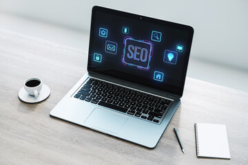 Laptop displaying SEO concept with glowing icons on the screen, placed on a wooden desk with coffee, notebook, and pen. 3D Rendering