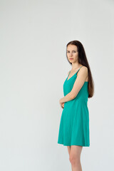 Slim cute young woman standing on a white background. Copy space