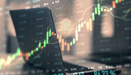 Financial data visualization with candlestick chart on blurred laptop screen background.