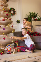 child playing with christmas tree