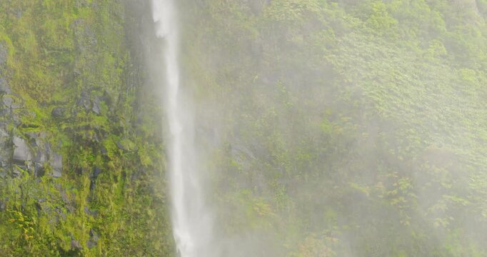 Detail of the waterfall 'Po&ccedil;o do Bacalhau'; a strong wind blows the water away, isle of Flores, Azores Portugal