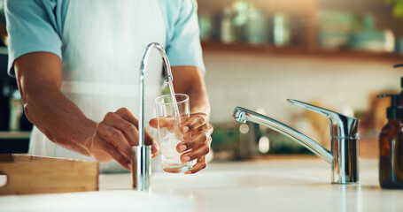 Person, kitchen and hands with glass of water in tap for fresh drink, liquid and hydration. Sink...