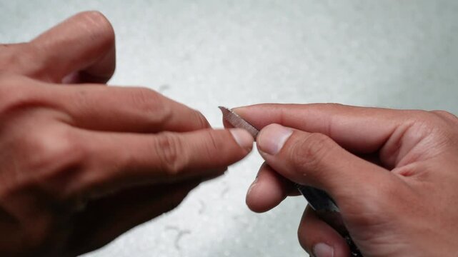 cutting fingernails, manicures, and filing fingernails to smooth newly cut nails as a form of personal hygiene.