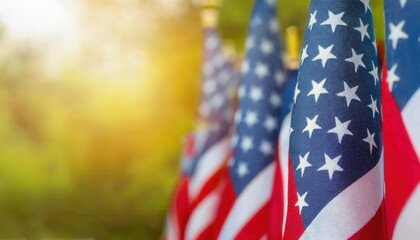 Close-Up View of Vibrant American Flags Waving Outdoors on a Sunny Day with Golden Light and Greenery in the Background. Perfect for Celebrating Patriotic USA Holidays, Memorial Day, or July 4th Event