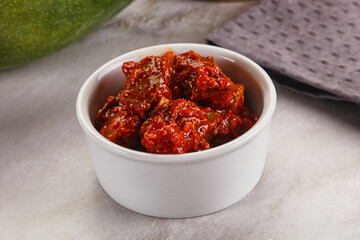 Spicy pickled raw green mango