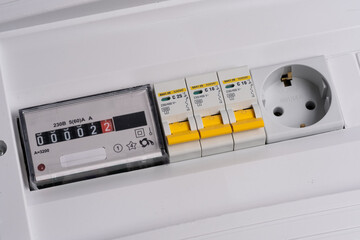 Electricity meter and automatic disconnection machines with an outlet in white shield.