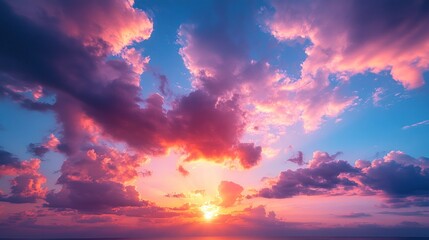 Naklejka premium A vibrant sunset with colorful clouds illuminating the sky over the ocean.