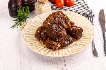 Prepared tasty beef ribs with sauce