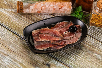 Canned anchovy with oil in the bowl