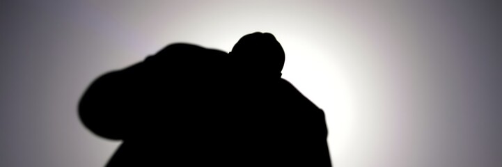 Dramatic silhouette against bright backlight in upward perspective view