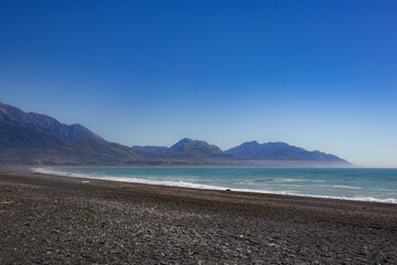 Beach in Kaikoura, New zealand with moutains in background
