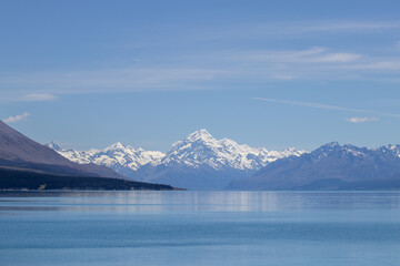 snow on mountain and lake mount cook new zealand
