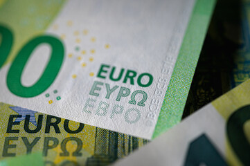 Close-up of a crisp 100 euro bill showing security elements and intricate design. Useful for themes...