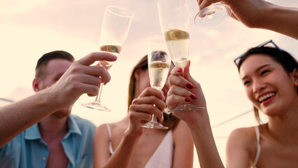 Group of business friends together celebrating and enjoying party with drinking champagne on sail...