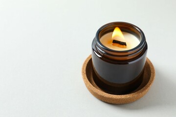 Handmade scented candle in a glass. Soy wax candle with a wooden wick