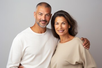 A man and woman are posing for a picture