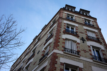 Brick building at the angle of rue compans and rue de Mouzaia - 19th arrondissement - Paris - France