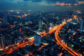 As dusk settles over the city, the skyline comes alive with vibrant lights, busy roads, and towering buildings, illustrating the vibrant energy of urban life at twilight.