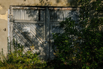 An old barn doors of the abandoned place