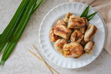 Grilled Banana with Coconut sauce, top view food table	
