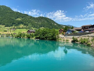 Naklejka premium Lake Lungern or Natural reservoir Lungerersee - Canton of Obwald, Switzerland (Naturstausee Lungernsee oder Lungerensee - Kanton Obwald, Schweiz)