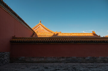 The red wall of the Forbidden City in Beijing at dusk