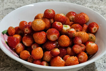 A plate full of fresh ripe strawberries
