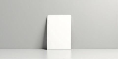 Blank vertical notebook on a smooth surface with soft shadows for mockup or design purposes