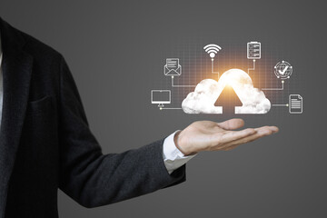 A man holds a cloud with an arrow sign, about the internet and connectivity.