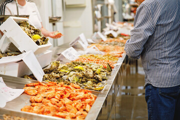 Stunning Fresh fish and seafood stall in The Central Market of Cadiz. It is the oldest covered market in Spain. © Irina Schmidt