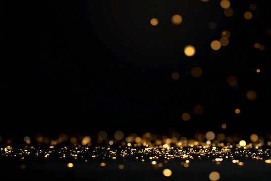 A luxurious black background adorned with scattered gold confetti, ideal for glamorous celebrations or festive events like New Year's, weddings, and anniversaries 2025