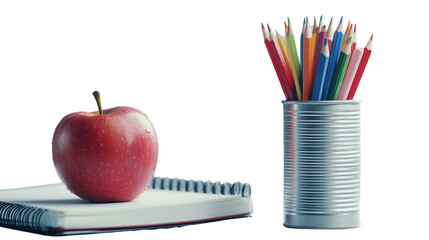 An apple on top of a spiral notebook, colored pencils, and a pencil in a canister, on a transparent backgrounds