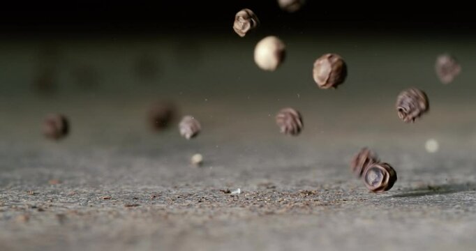 Peppercorns or black pepper spice. Super Macro Close Up. Shot on super slow motion camera 1000 fps.