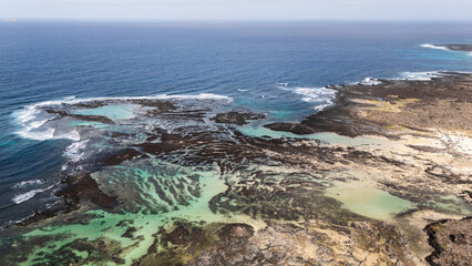 Drone view of stunning coastal view with turquoise waters and rocky shores