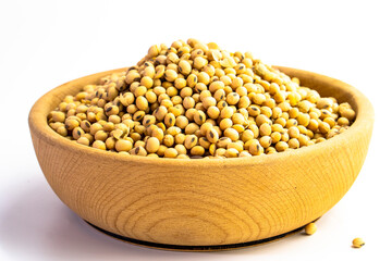 Organic soy beans falling into a rustic wicker bowl. Raw dried soya grains. Healthy legume ingredient. Rotation. Food